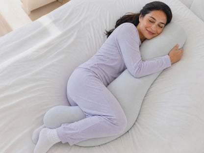 Side sleeper snuggling into the Snuggl Body Pillow