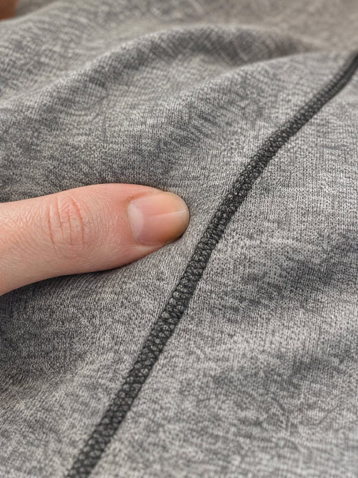 Close-up of the soft stretch knit and flat seam of the Snuggl Pod