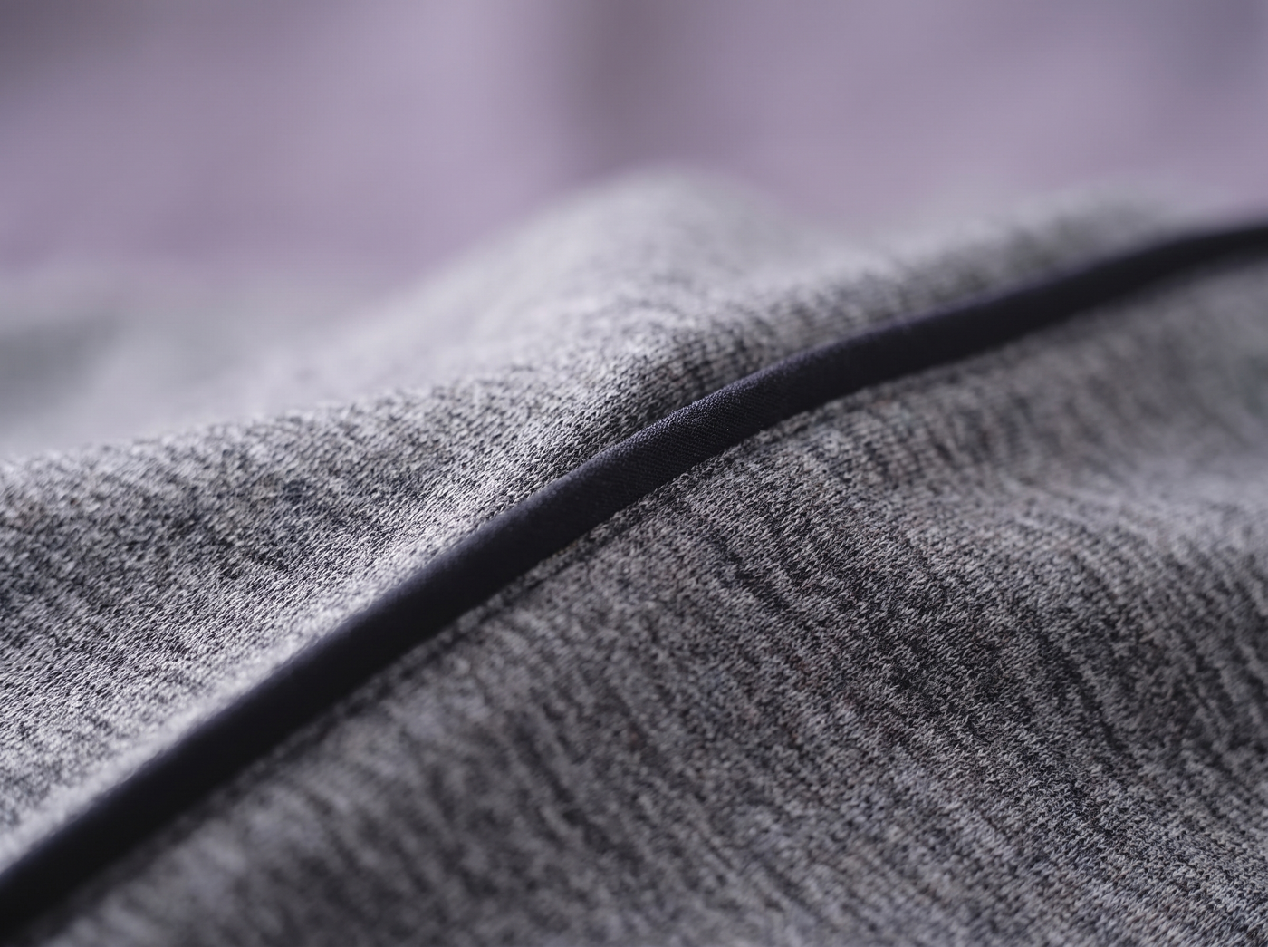 Macro of the ultra soft heathered Snuggl Pod fabric with piping